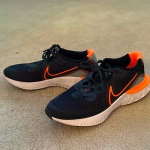 Black and orange Nike shoes size 6y. very light and comfy to wear.